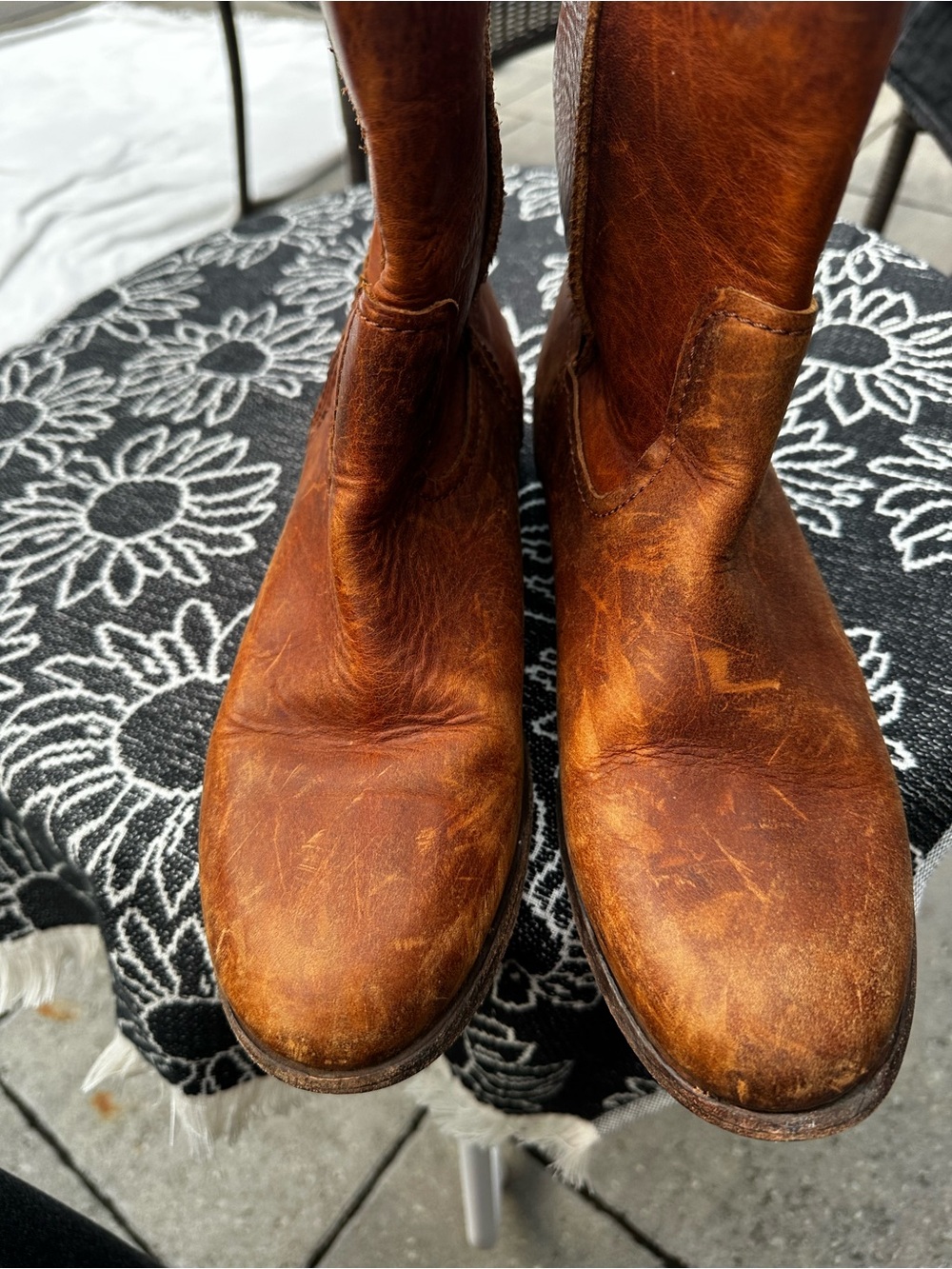 Frye Cara Short pull-on ankle boots in a cognac distressed brown